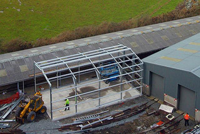Aerial shot of building under construction in train yard